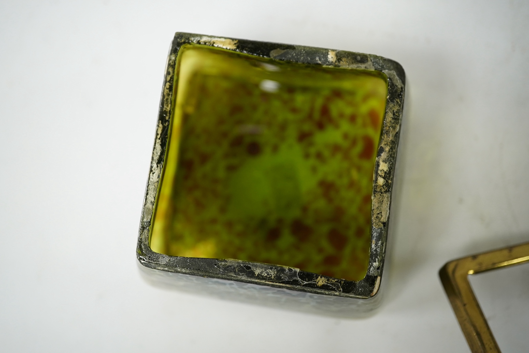 A Loetz glass and brass lidded box, 9.5cm wide. Condition - lid detached